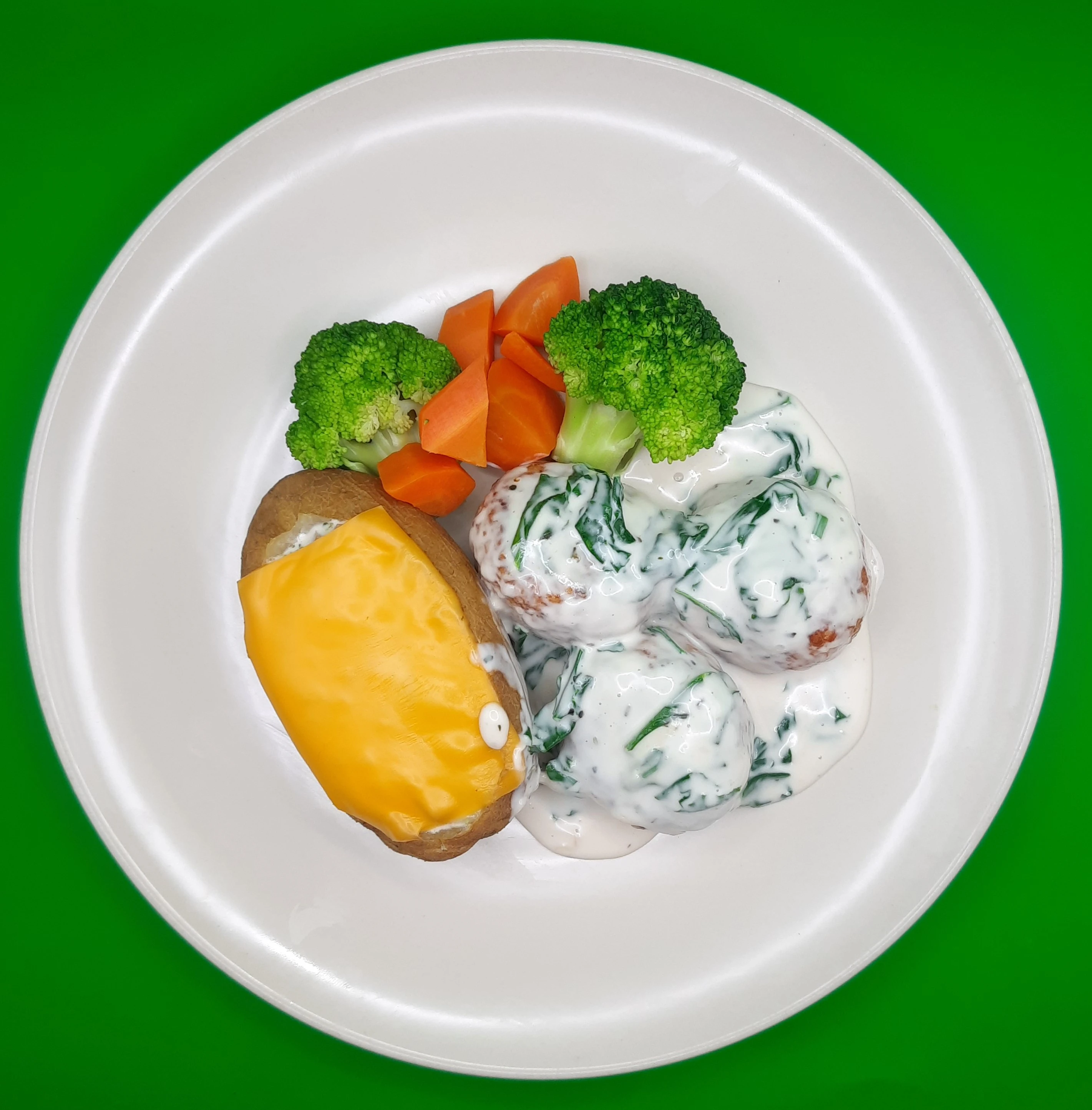 Creamy spinach chicken balls with jacket potato
